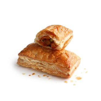 Golden flaky vegetable puff with filling visible inside
